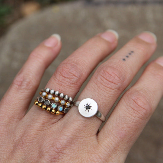 Disc with Star Set Black Onyx Ring